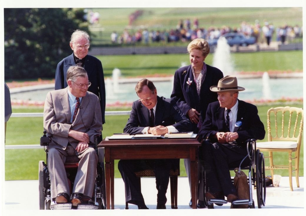 George H.W. Bush signing ADA with onlookers outside